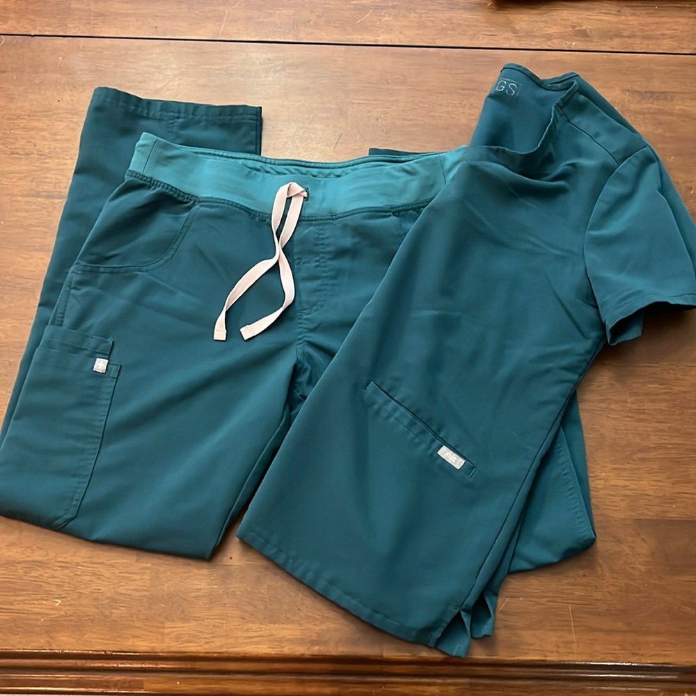 Used Caribbean Blue size medium women’s scrubs.